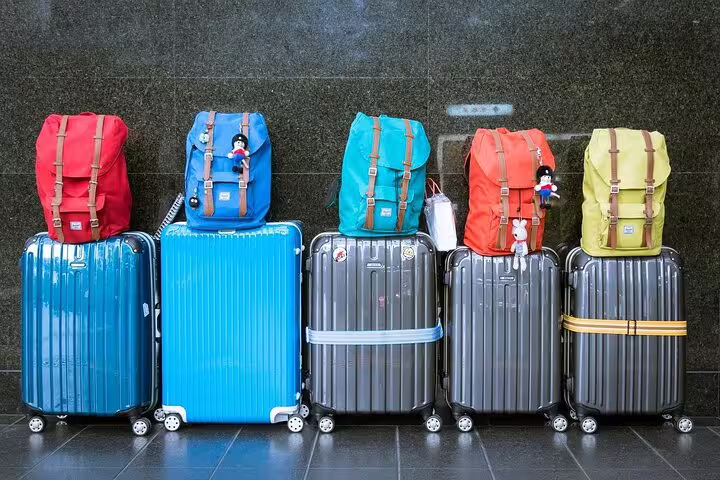 Suitcases and backpacks ready for private transfer from Madrid Barajas Airport to Madrid, ideal for families