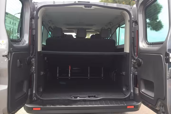 Open trunk showing large luggage space in minivan for private transfer Marseille to Avignon with driver