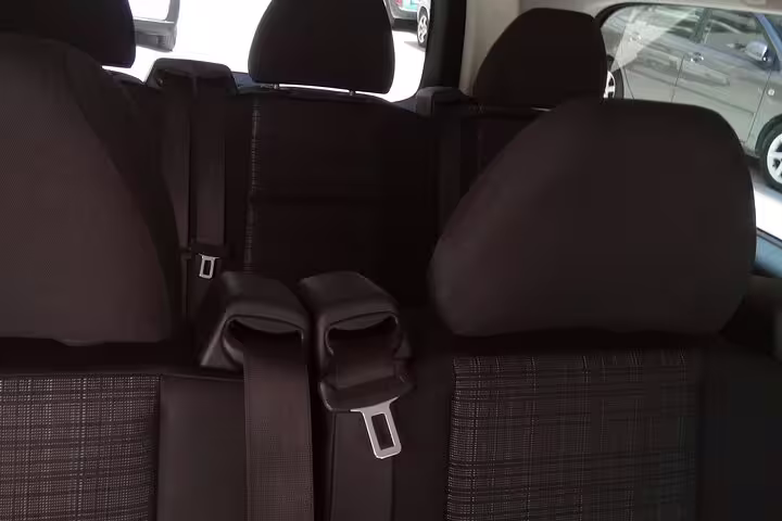 Comfortable rear seats inside private transfer vehicle from Ancient Olympia to Athens with seatbelts