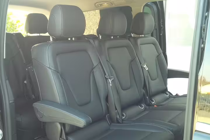 Spacious leather seating in a premium van for comfortable private transfers from Treviso Canova Airport to Piazzale Roma.