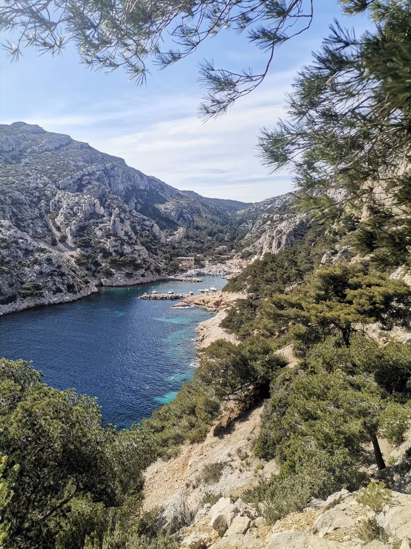Scenic Calanques inlet with turquoise water and limestone cliffs, highlight of a 7-day Provence hiking getaway