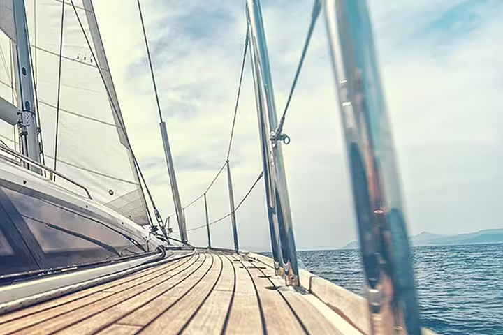 View from a yacht deck sailing on calm waters under a clear sky, perfect for a Puerto Colón dolphin watching tour.