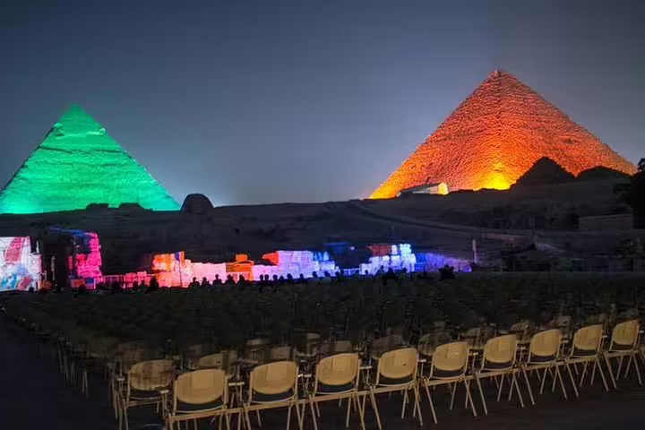 Pyramids of Giza Sound and Light Show from Cairo with colorful illuminations and seating at night