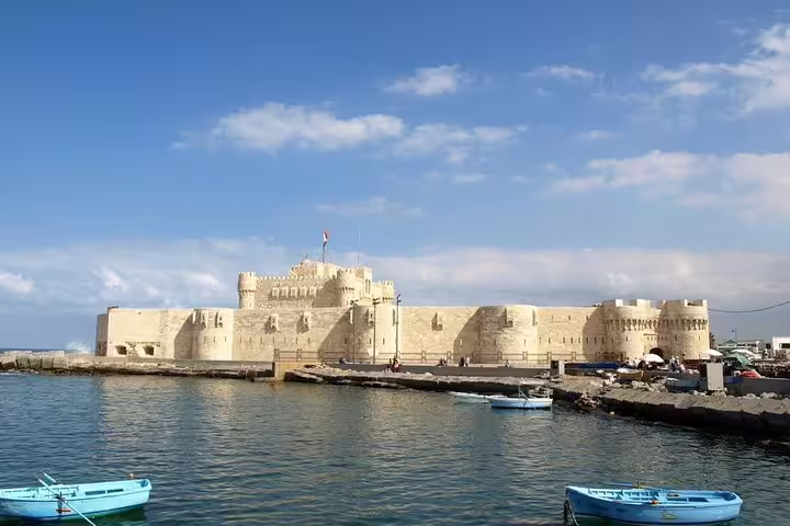 Qaitbay Citadel in Alexandria harbor with boats, a highlight on Egypt tours package 6 days itinerary