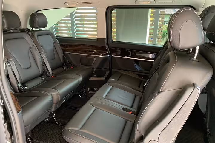 Comfortable seating in a transfer van from Ravenna cruise terminal to Bologna Airport.