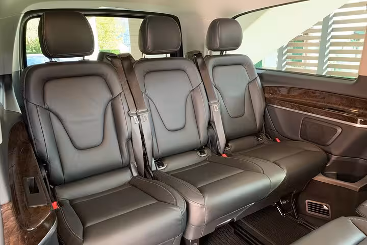 Spacious leather interior of a transfer vehicle from Ravenna cruise terminal to Bologna Airport.