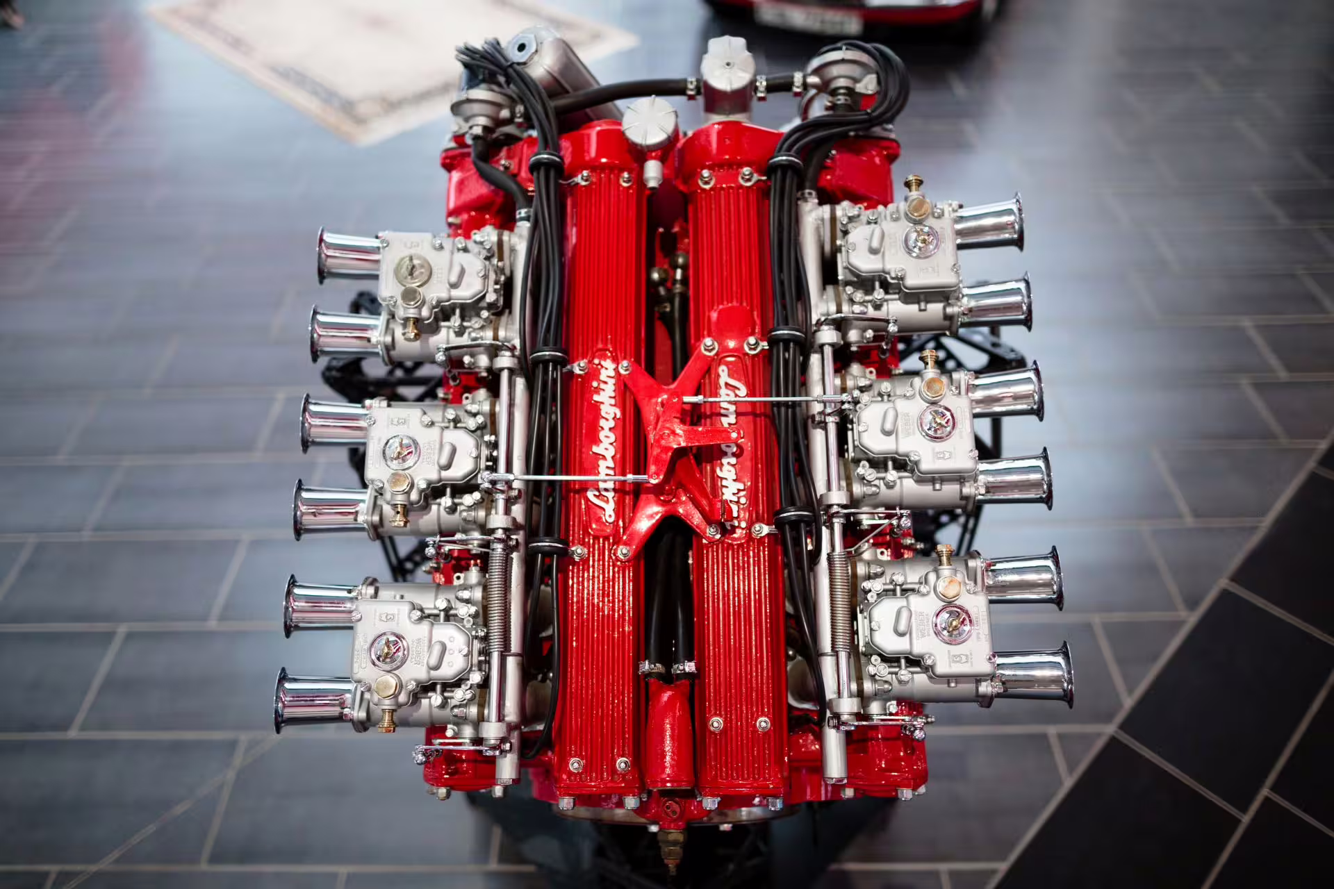 Close-up of red Lamborghini V12 engine display at the Lamborghini Museum near Bologna, combo museums entry ticket