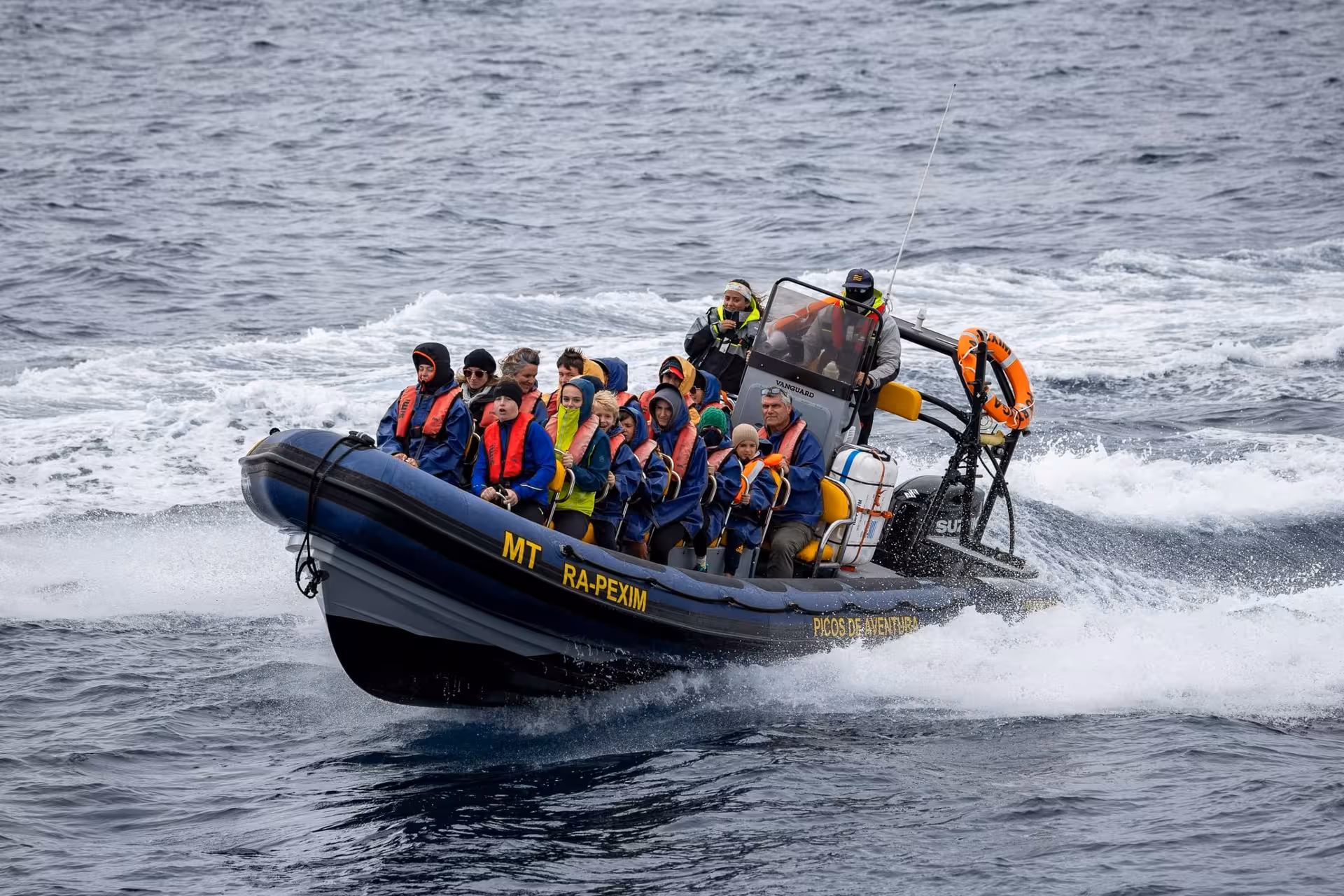 RIB speedboat with guests in life jackets on full-day maritime experience tour with lunch, coastal adventure at sea