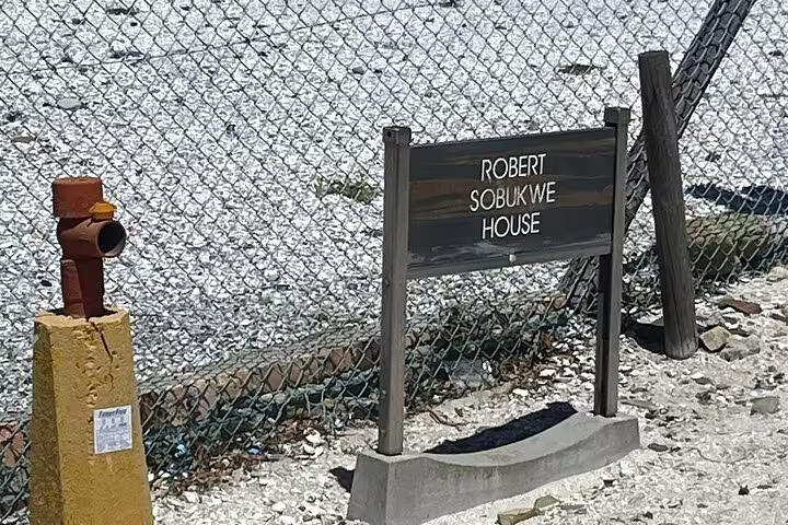 Sign for Robert Sobukwe House on Robben Island, a key historical site on the guided museum tour.