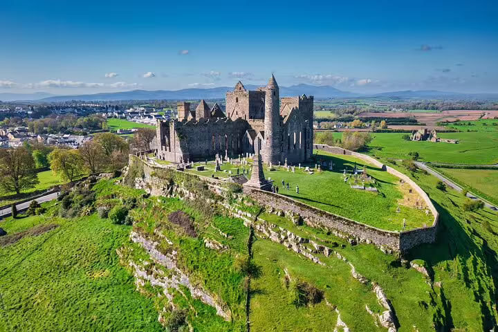 Aerial view of the Rock of Cashel on a hilltop, a highlight on the Dublin to Cork and Blarney Castle tour