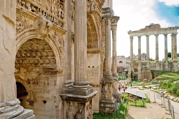 Detailed view of ancient arches and columns in the Roman Forum on a private guided tour from the Colosseum arena