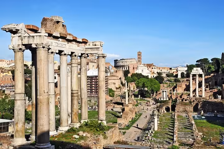 Stunning view of the Roman Forum's towering columns and ancient ruins, a highlight of the Colosseum tour package.