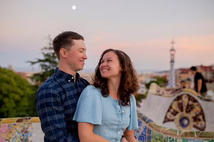 Romantic couple portrait at Park Güell viewpoint at sunset on a private Barcelona travel photographer tour