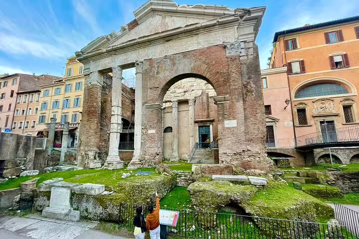 Travelers exploring the ancient Portico d’Ottavia ruins in central Rome on a 3 day private guided sightseeing tour