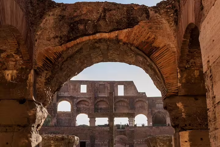 Close-up of ancient brick archways and interior walls of the Rome Colosseum seen on an exclusive arena and Roman Forum private tour