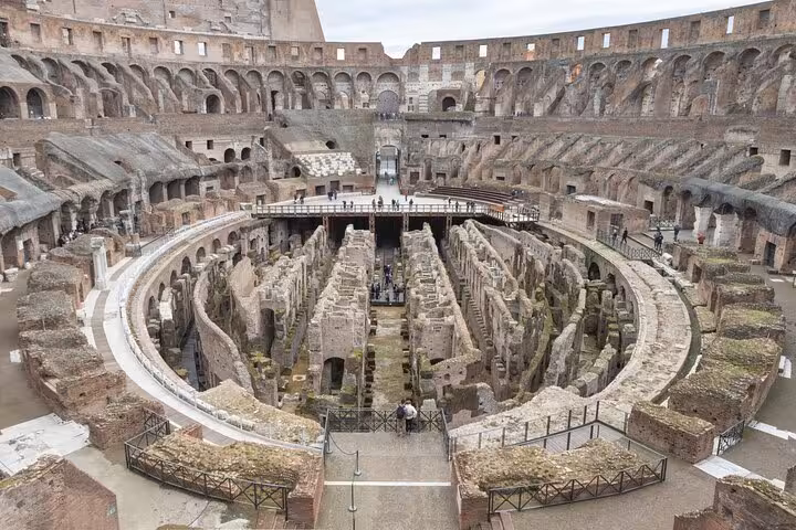 Panoramic view of the Colosseum arena and underground ruins in Rome on a self-guided tour with Forum and Palatine Hill