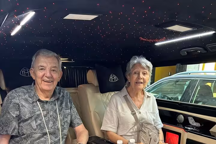 Travelers in luxury van en route from Rome to Florence for guided sightseeing day trip in Tuscany