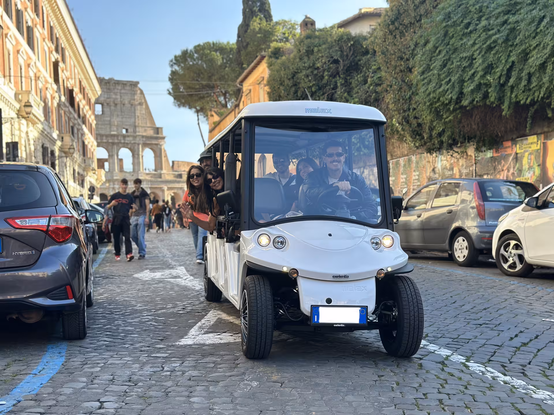 Explore Rome's historic streets on a golf cart tour with views of the Colosseum, perfect for night adventures.
