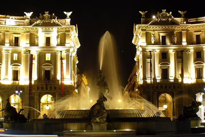 Illuminated Piazza della Repubblica and Fountain of the Naiads on a chauffeured Best of Rome by Night private tour
