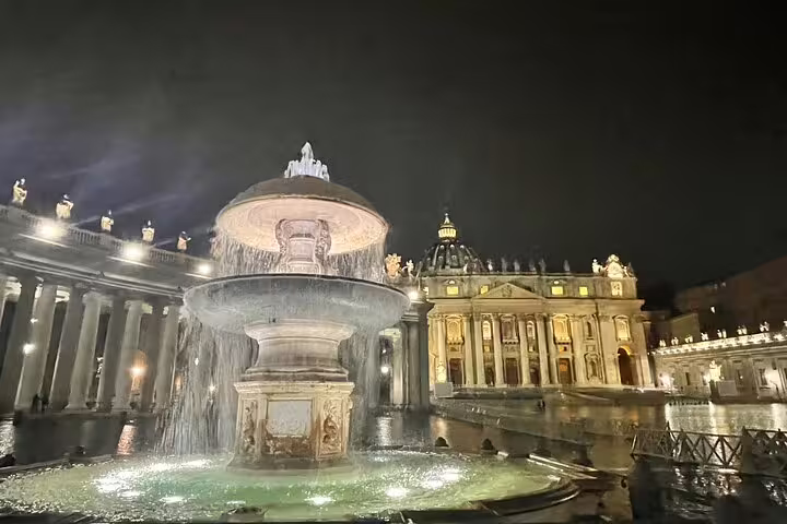 St Peter’s Square fountain and illuminated basilica at Vatican City on a Rome by night private chauffeured tour