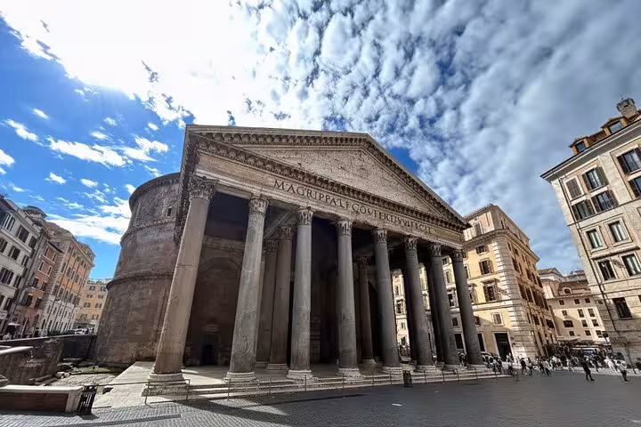 Visit the iconic Pantheon in Rome, a must-see stop on the highlights tour with pizza and gelato making experience.