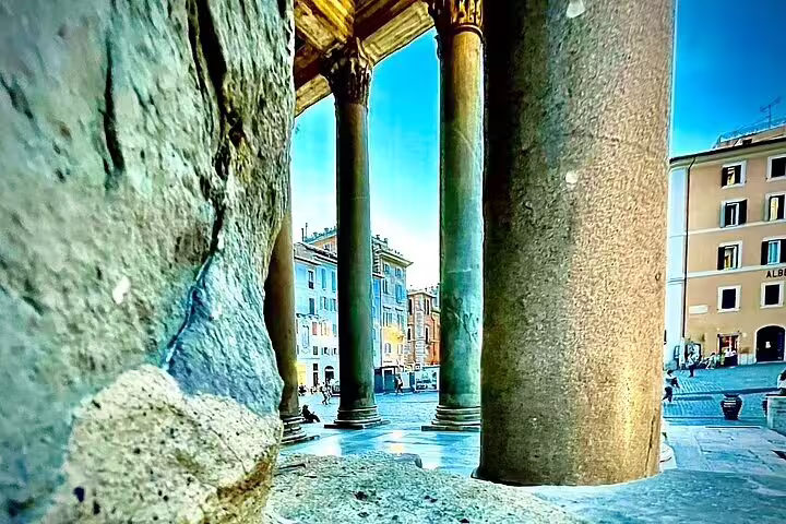 View from the Pantheon portico columns onto Piazza della Rotonda, explored on a private chauffeured Rome tour