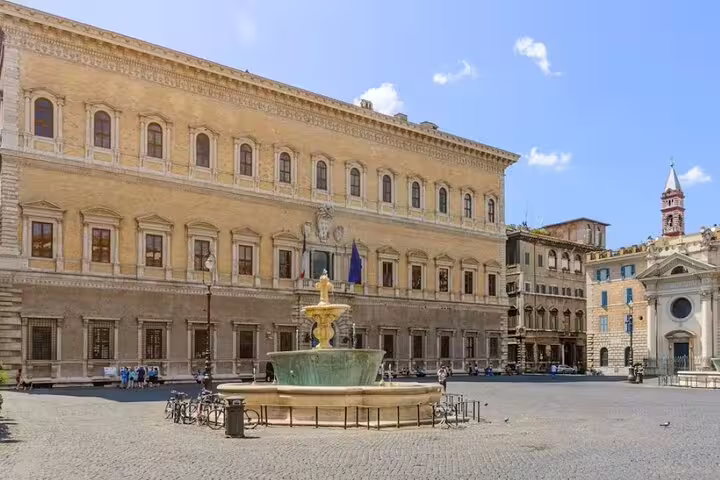Quiet Piazza Navona-style square in Rome with Renaissance palace, central fountain and papal history on small group walking tour