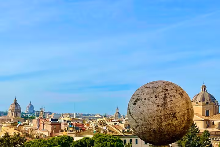 Panoramic view of Rome’s historic skyline from a private chauffeured tour, showcasing domes and landmarks under a blue sky