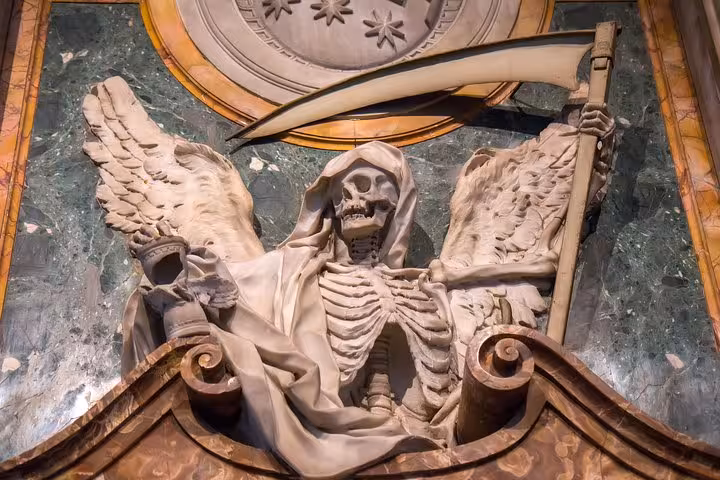 Dramatic marble skeleton with scythe sculpture inside a Rome basilica, highlighting macabre art on a hidden underground tour