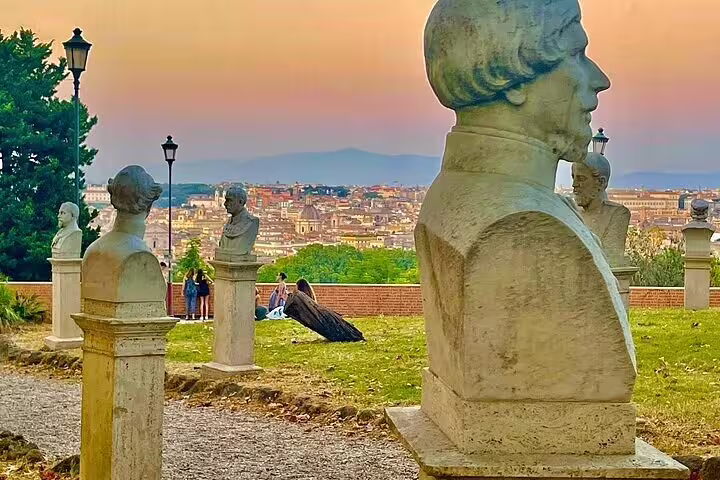 Sunset view over Rome from a scenic park with marble busts and city panorama on a private chauffeured tour stop