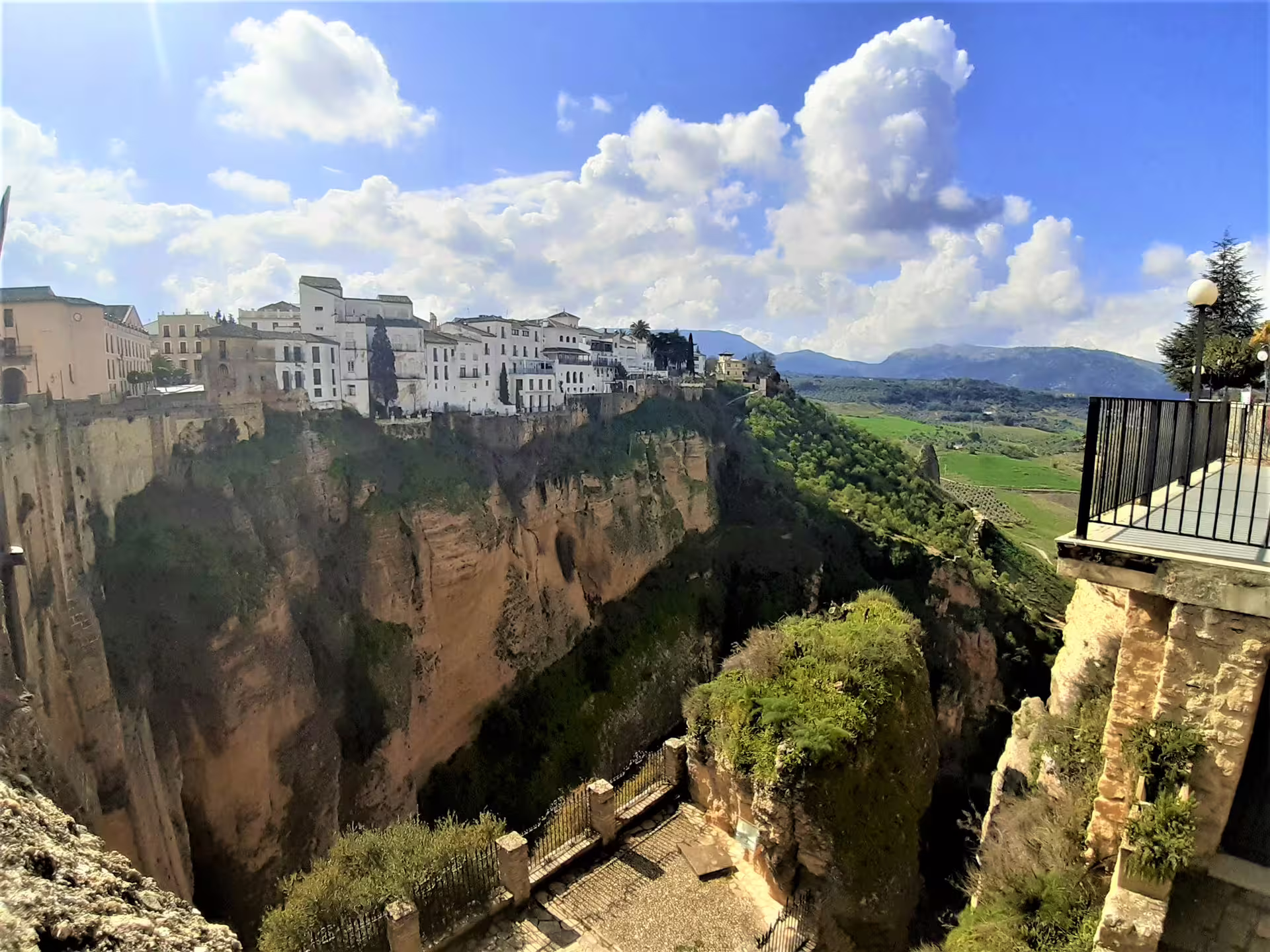 Panoramic view of Ronda’s El Tajo gorge and whitewashed old town from a scenic viewpoint on a guided walk