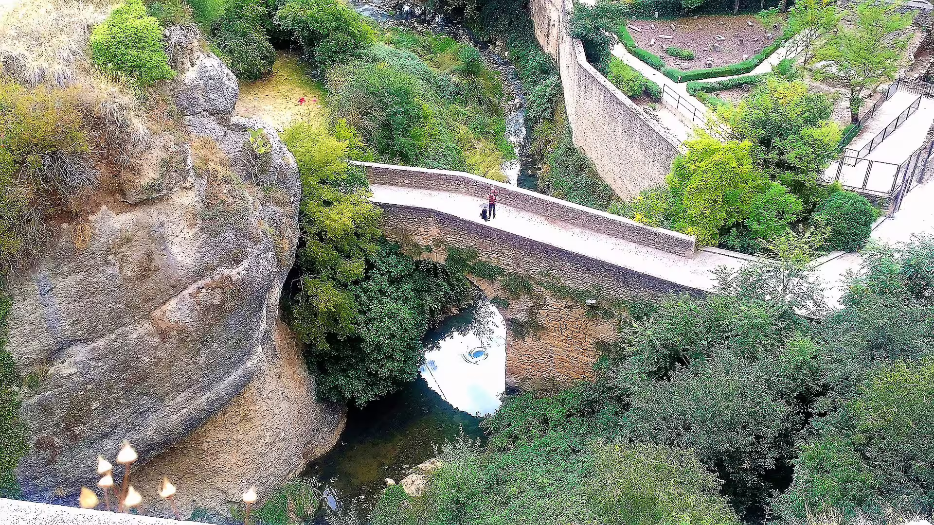 Stone footbridge over a stream in Ronda gorge, scenic stop on a private tour from Costa del Sol