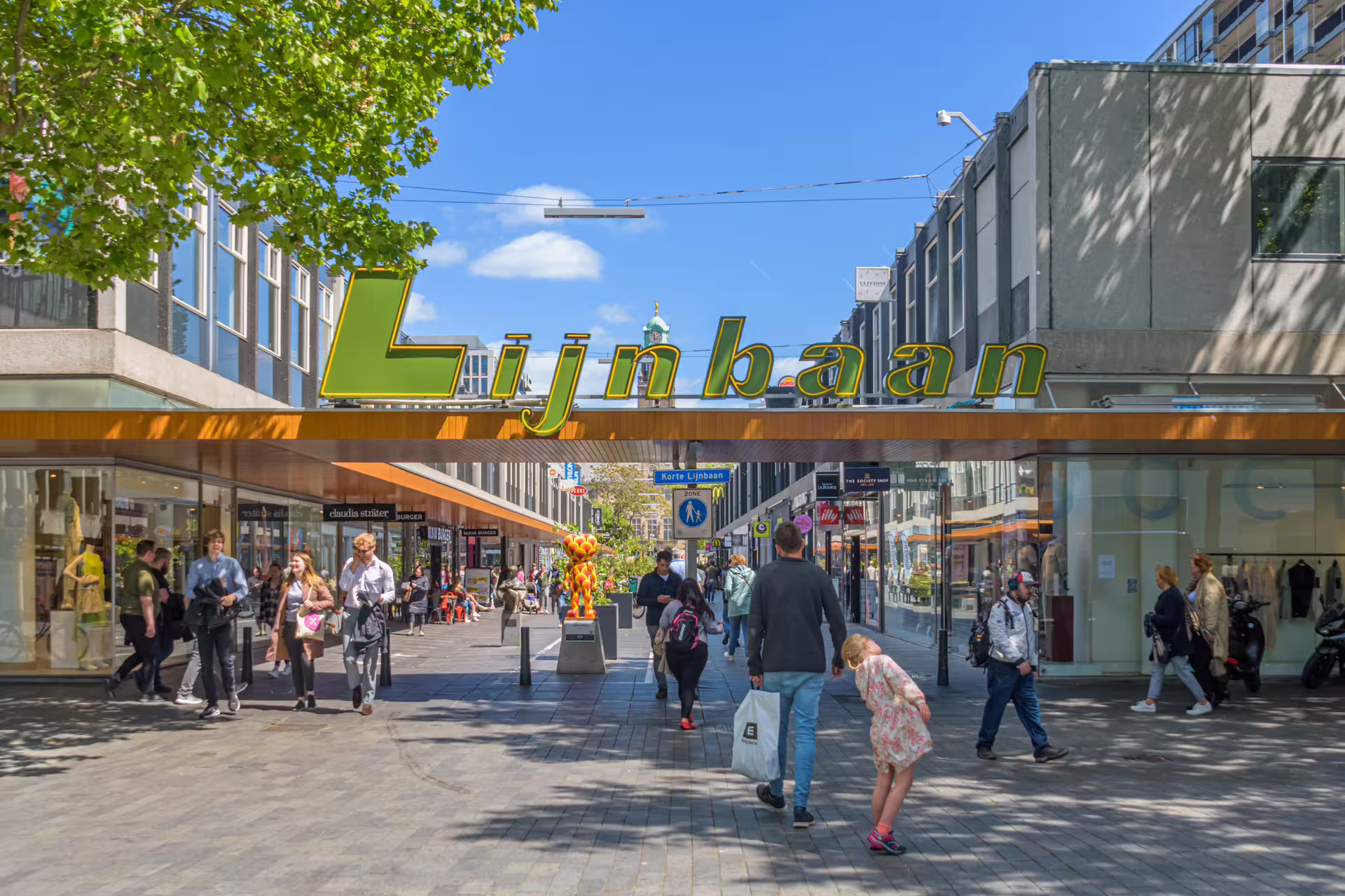 Lijnbaan shopping street in Rotterdam, lively city center scene on 1-day walking tour with audioguide