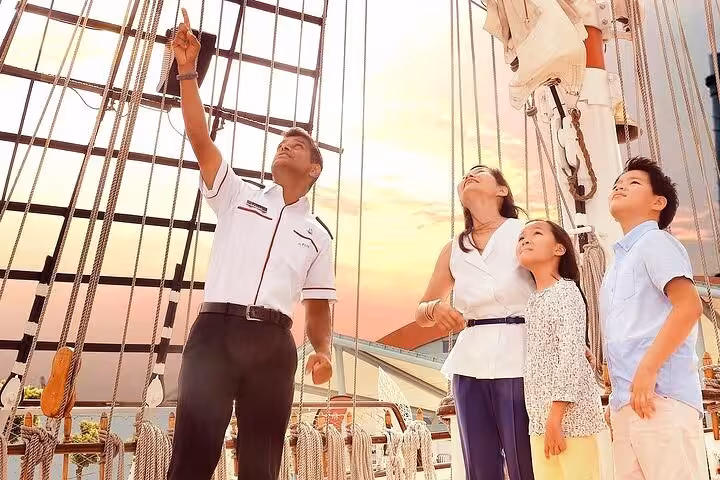 Family enjoying a guided tour on the Royal Albatross, experiencing a dog-friendly breakfast cruise at sunset.