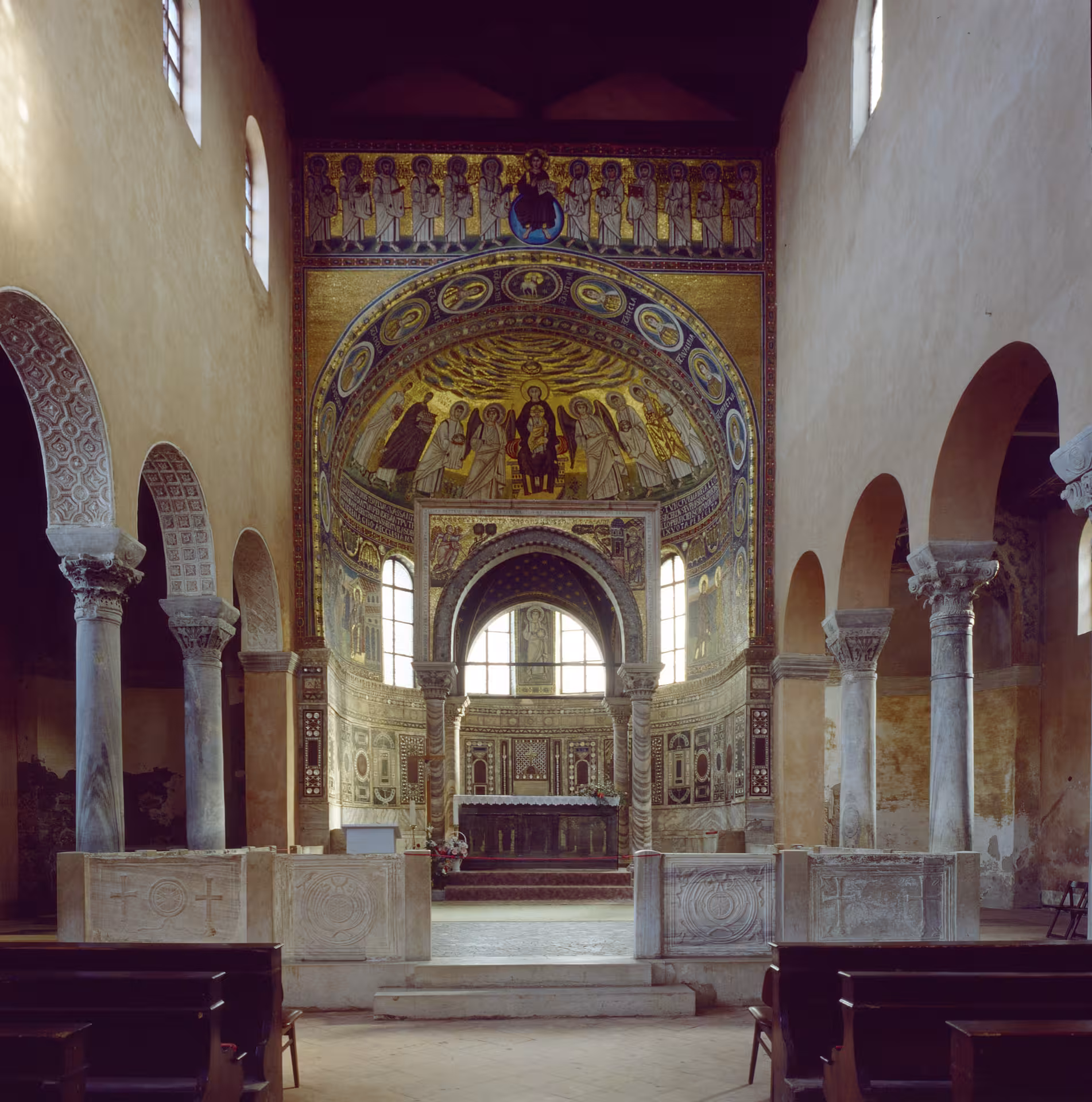 Interior view of the Royal Chapel with stunning mosaic artwork and columns, highlighting historical architecture.