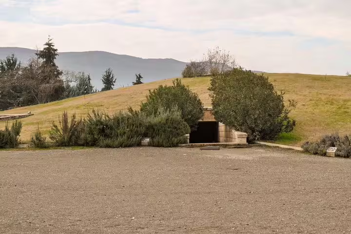 Entrance to the Royal Tombs of Vergina museum mound on a full-day Meteora and Vergina tour from Athens