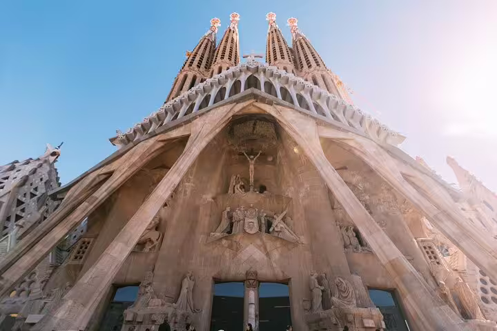 Exterior of Sagrada Familia's Nativity Facade, highlighting Gaudí's detailed sculptures on a private guided tour.