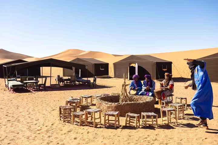 Sahara desert camp with Berber music by the fire, dunes near Marrakech on Anti-Atlas 8-day tour