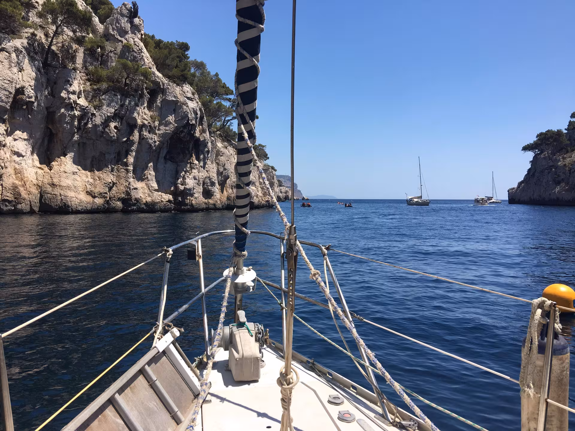 View from sailboat bow cruising the Mediterranean coast, ideal for a 3-day boat trip with snorkeling stops
