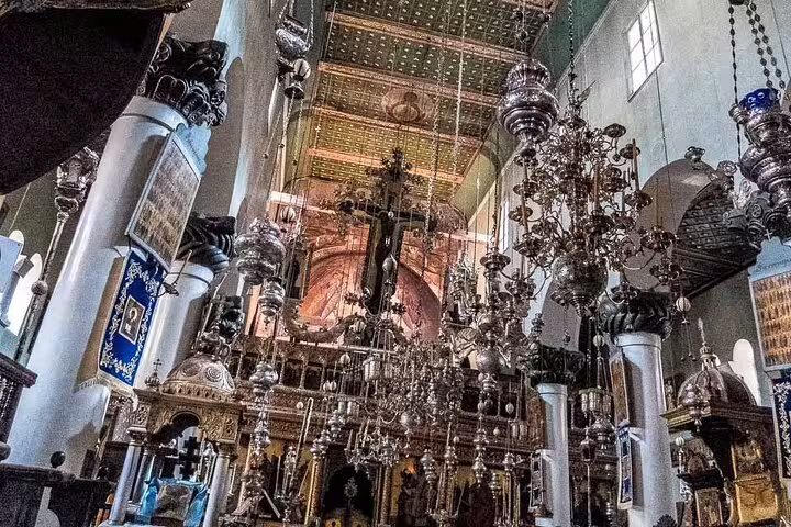 Interior of Saint Catherine Monastery church on Mount Sinai climb from Dahab tour, icons and chandeliers