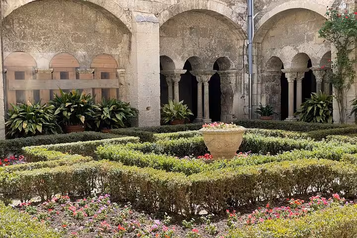 Cloister garden at Saint-Paul-de-Mausole monastery in Saint-Rémy-de-Provence on a private day trip from Arles