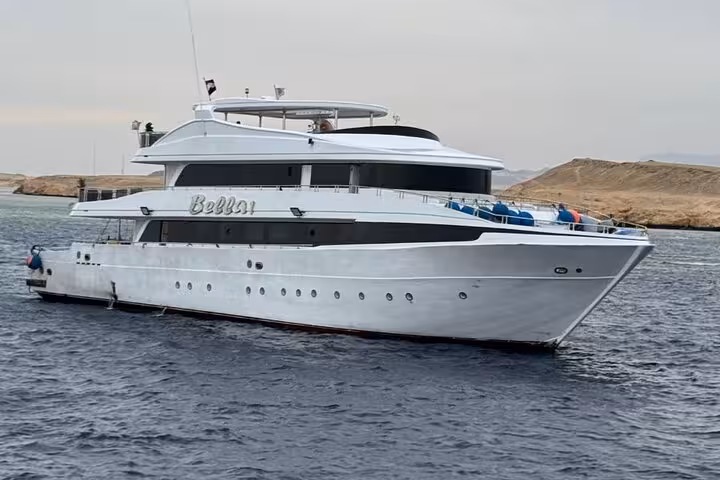 White dive boat cruising from Marsa Alam to Samadai Reef Dolphin House for snorkeling and dolphin watching