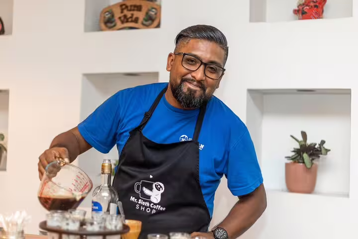 A bartender skillfully prepares drinks during the San Jose By Night tour's cocktail class experience.