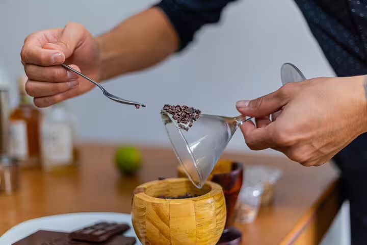 Close-up of chocolate garnishing for cocktail class on San Jose night tour, emphasizing artisanal farm-to-table dining.
