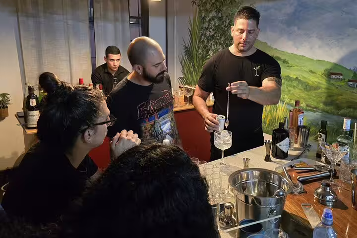 Guests participate in a cocktail-making class, learning mixology skills on the San Jose By Night tour.