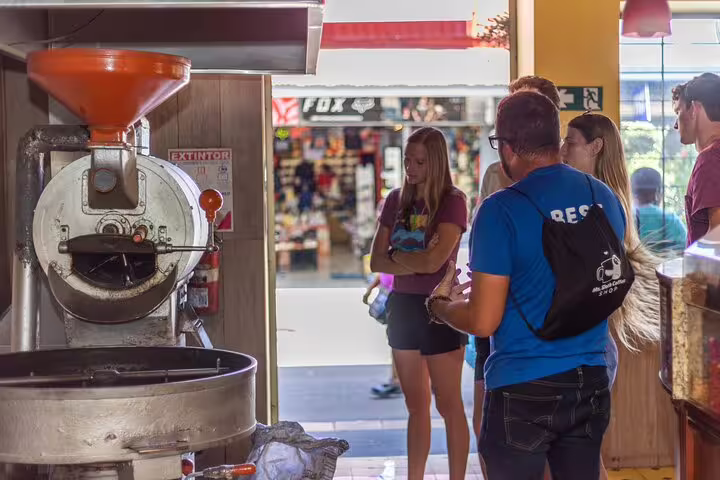 Tourists observe a coffee roasting process during the San Jose By Night Farm to Table Dinner & Cocktail Class.