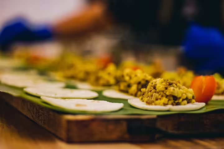 Gourmet farm-to-table appetizers being prepared with fresh ingredients on the San Jose By Night dining tour.
