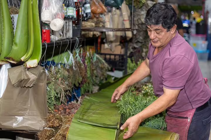 Local vendor preparing fresh ingredients at a San Jose market, perfect for a farm-to-table dining experience.