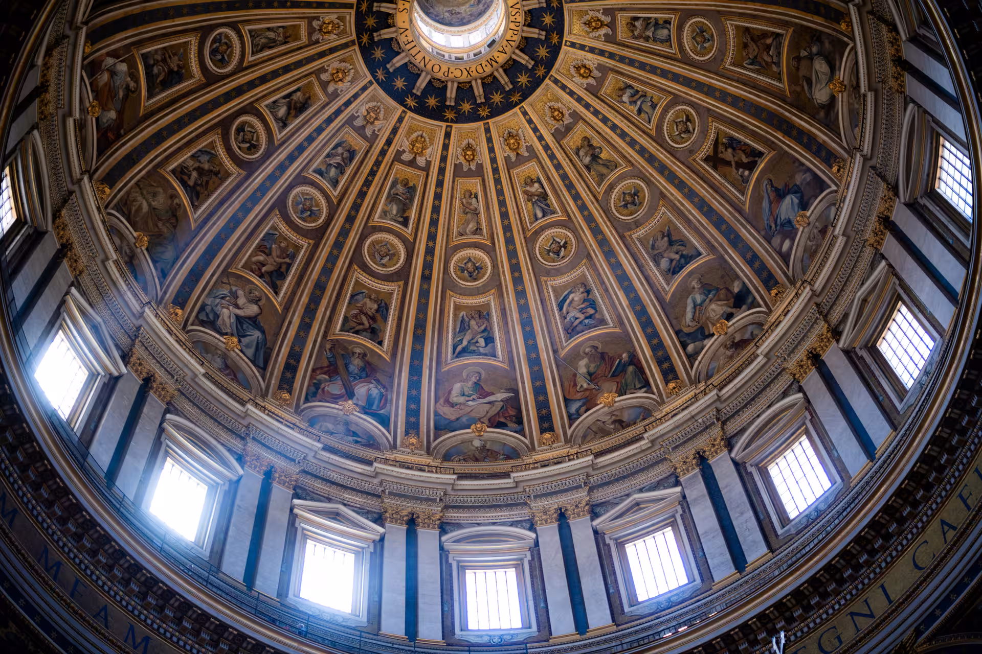 Intricate frescoes and architectural details of St. Peter's Basilica dome, a highlight on the San Pietro Basilica Combo Tour.