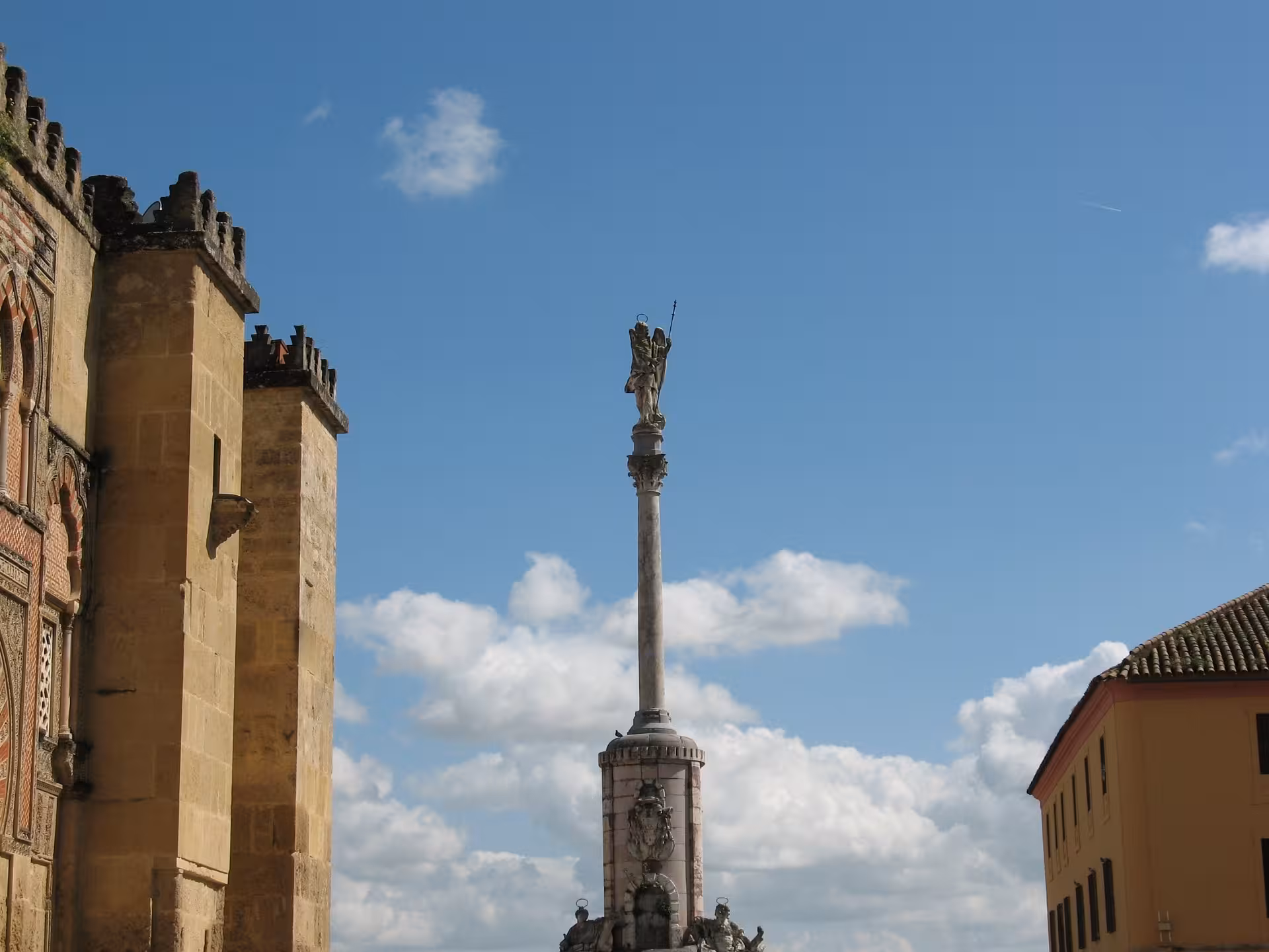 Triunfo de San Rafael column by the Mezquita-Catedral, iconic landmark on a free tour in Córdoba city center